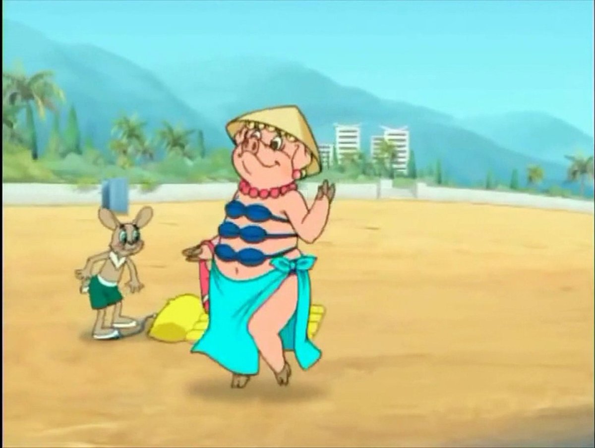 свинья из ну погоди на пляже в купальнике